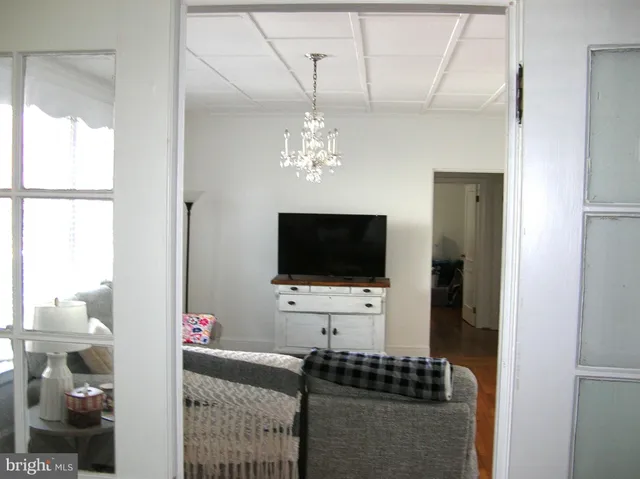 a living room with patio and a flat screen tv