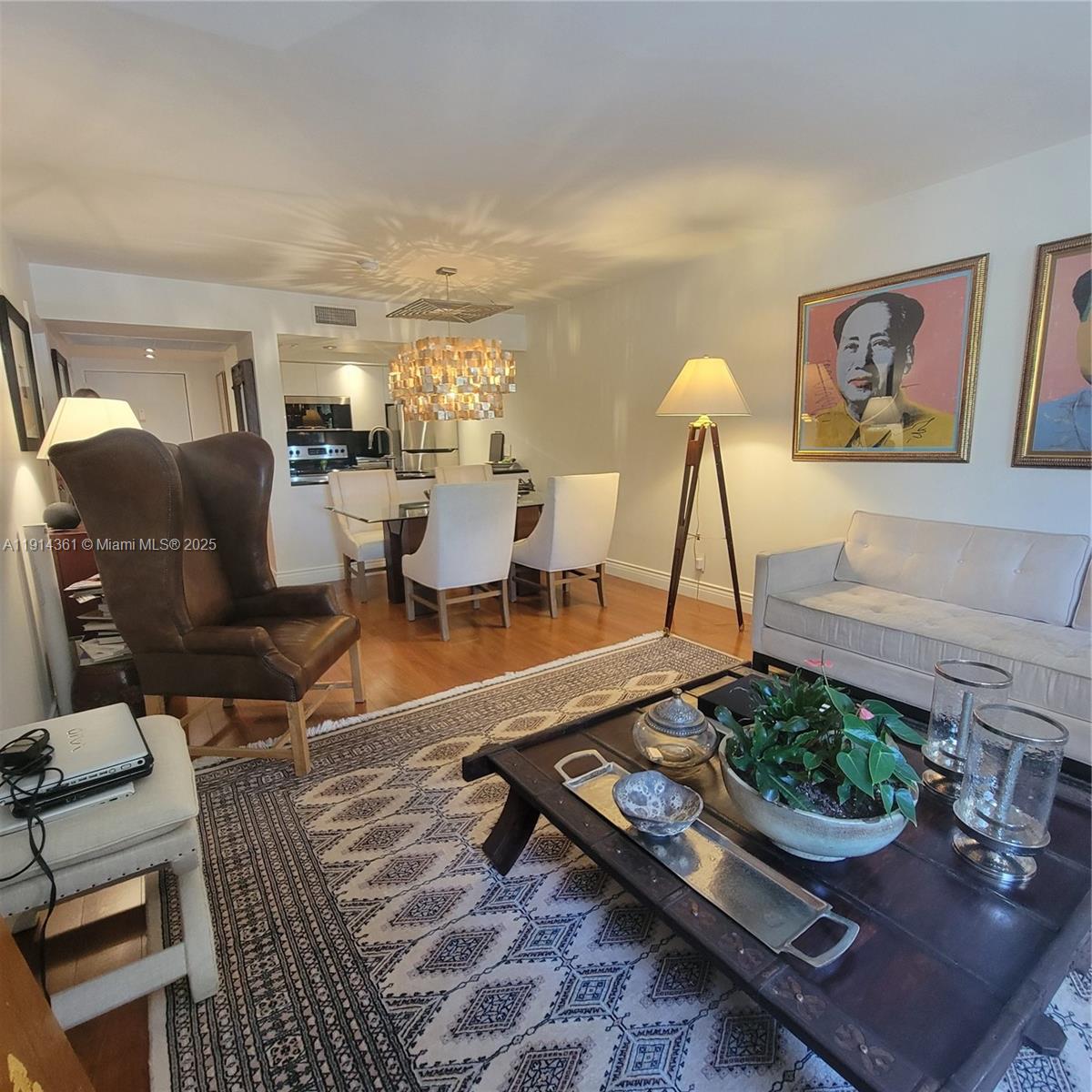 8180 Geneva Court, Unit 219 Doral, FL 33166 - Photo 6 of 19 a living room with furniture a rug and white walls