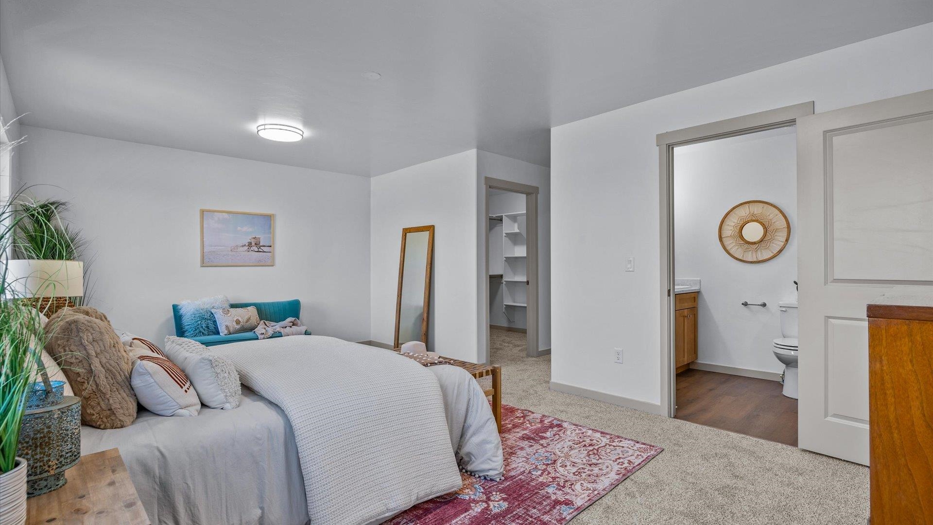 2786 Caspian Way, Unit A Grand Junction, CO 81503 - Photo 13 of 42 a bedroom with a bed and a lamp on dresser