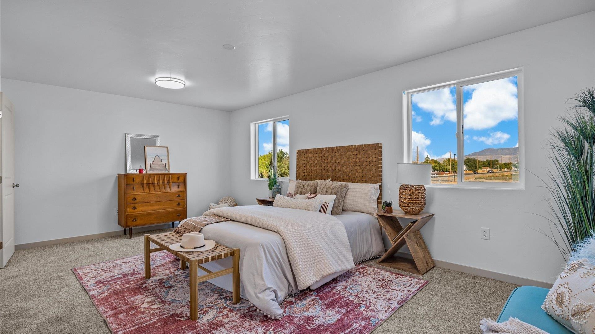 2786 Caspian Way, Unit A Grand Junction, CO 81503 - Photo 16 of 42 a bedroom with a bed and wooden floor