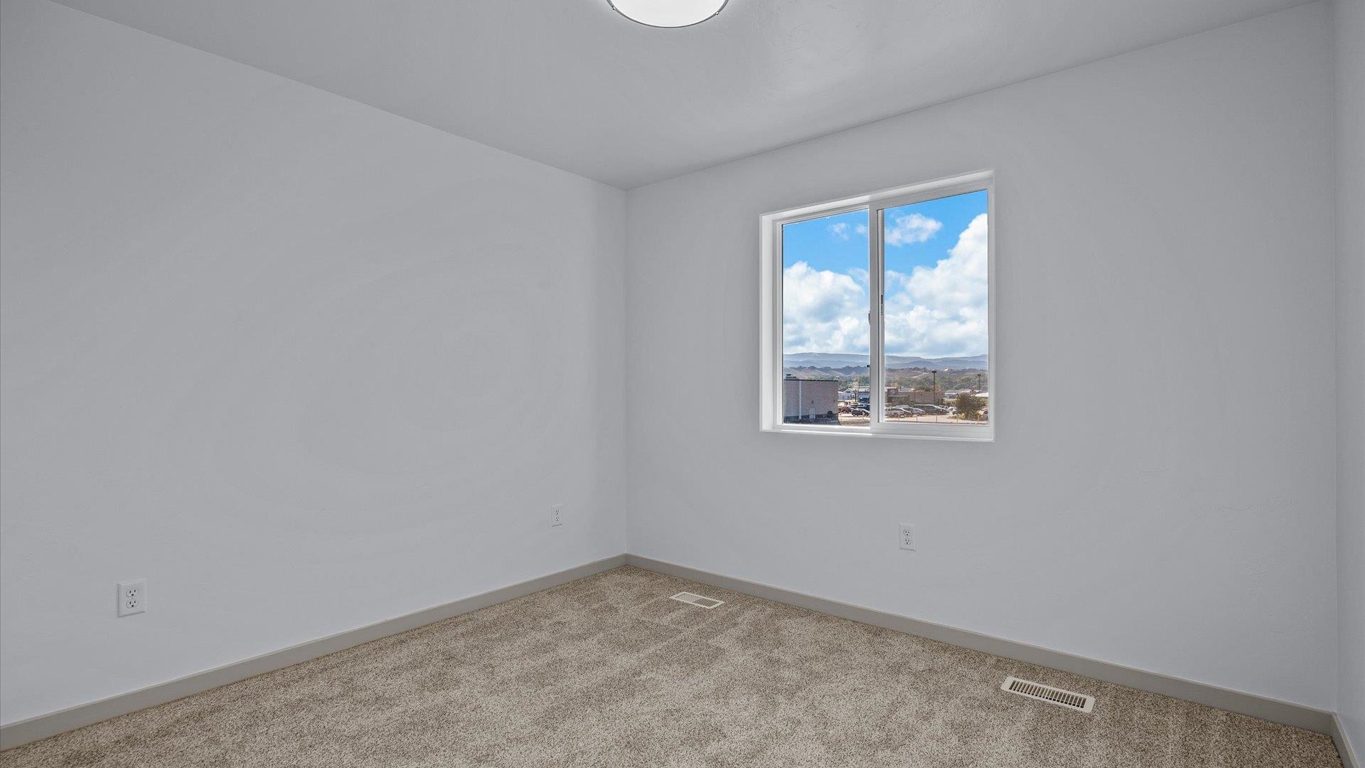 2786 Caspian Way, Unit A Grand Junction, CO 81503 - Photo 20 of 42 an empty room with windows