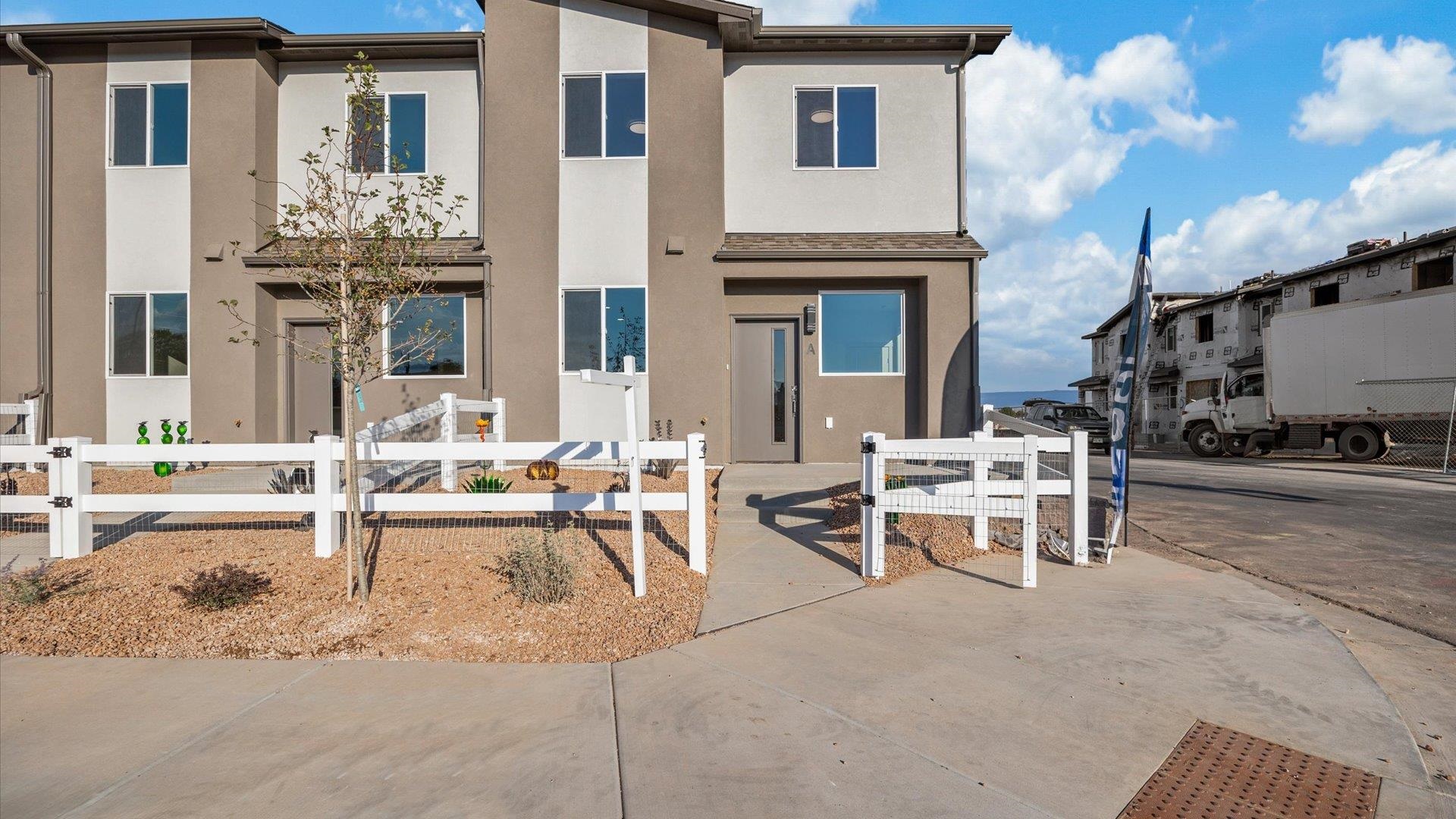 2786 Caspian Way, Unit A Grand Junction, CO 81503 - Photo 37 of 42 a view of a patio with dining table and chairs