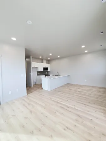 a kitchen with granite countertop a stove and a microwave