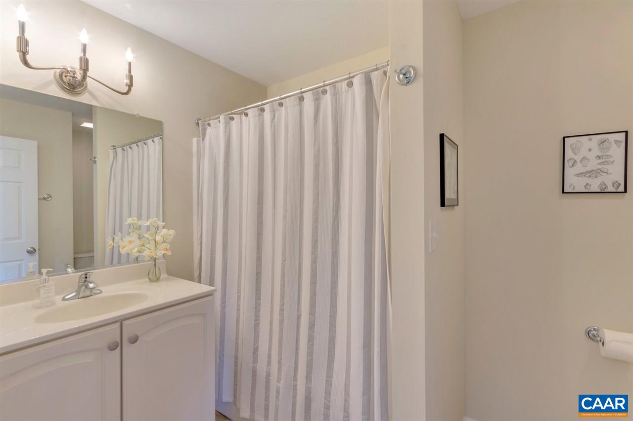 343 Quarry Road Charlottesville, VA 22902 - Photo 28 of 34 a bathroom with a double vanity sink and a mirror