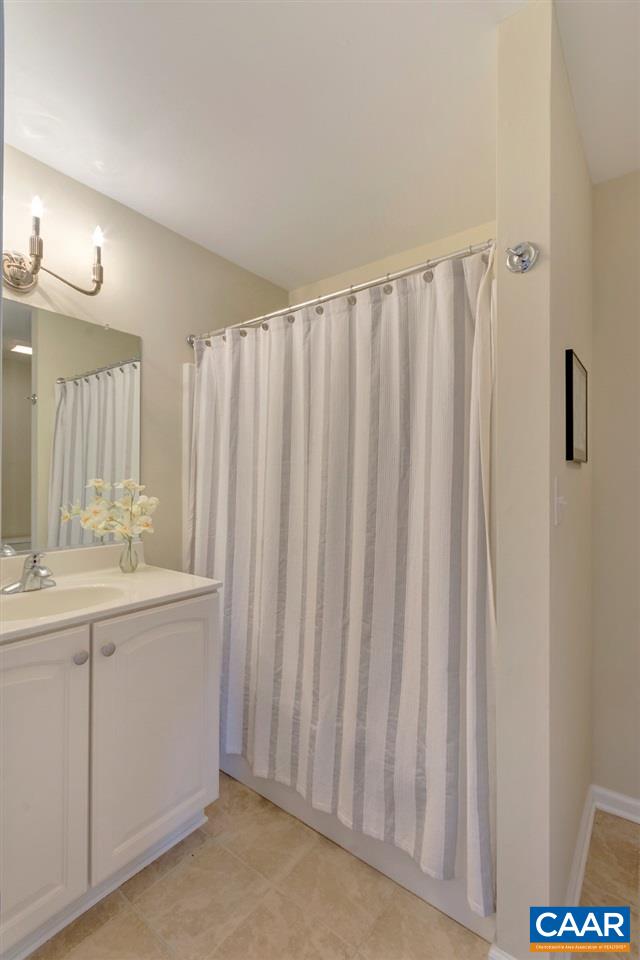 343 Quarry Road Charlottesville, VA 22902 - Photo 29 of 34 a bathroom with a double vanity sink and a mirror