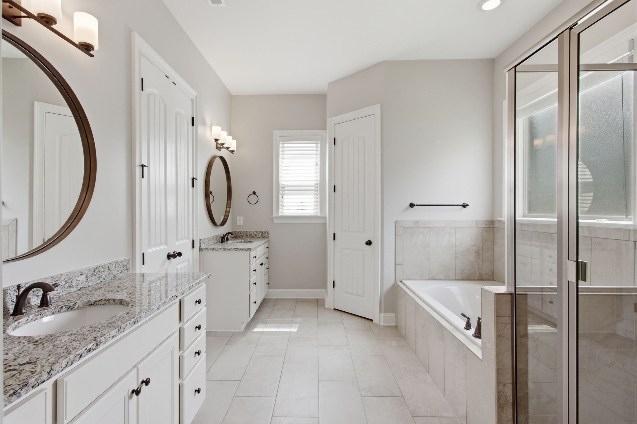 2720 Pool Forge Bridge Road Thompson's Station, TN 37179 - Photo 27 of 44 a spacious bathroom with a granite countertop sink mirror and shower