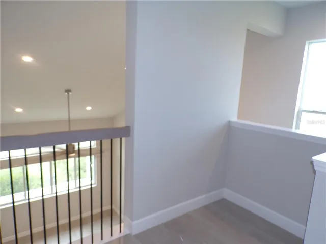 a white toilet sitting next to a shower