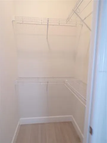 a view of a room with wooden floor and outdoor space