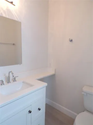 a kitchen with kitchen island a sink stainless steel appliances and cabinets