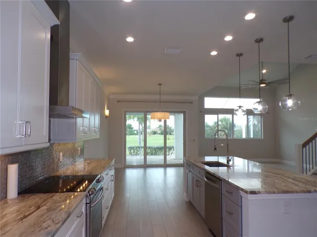 a view of a hallway with entryway and front door