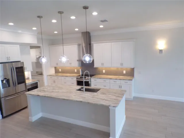 a kitchen with granite countertop lots of counter top space