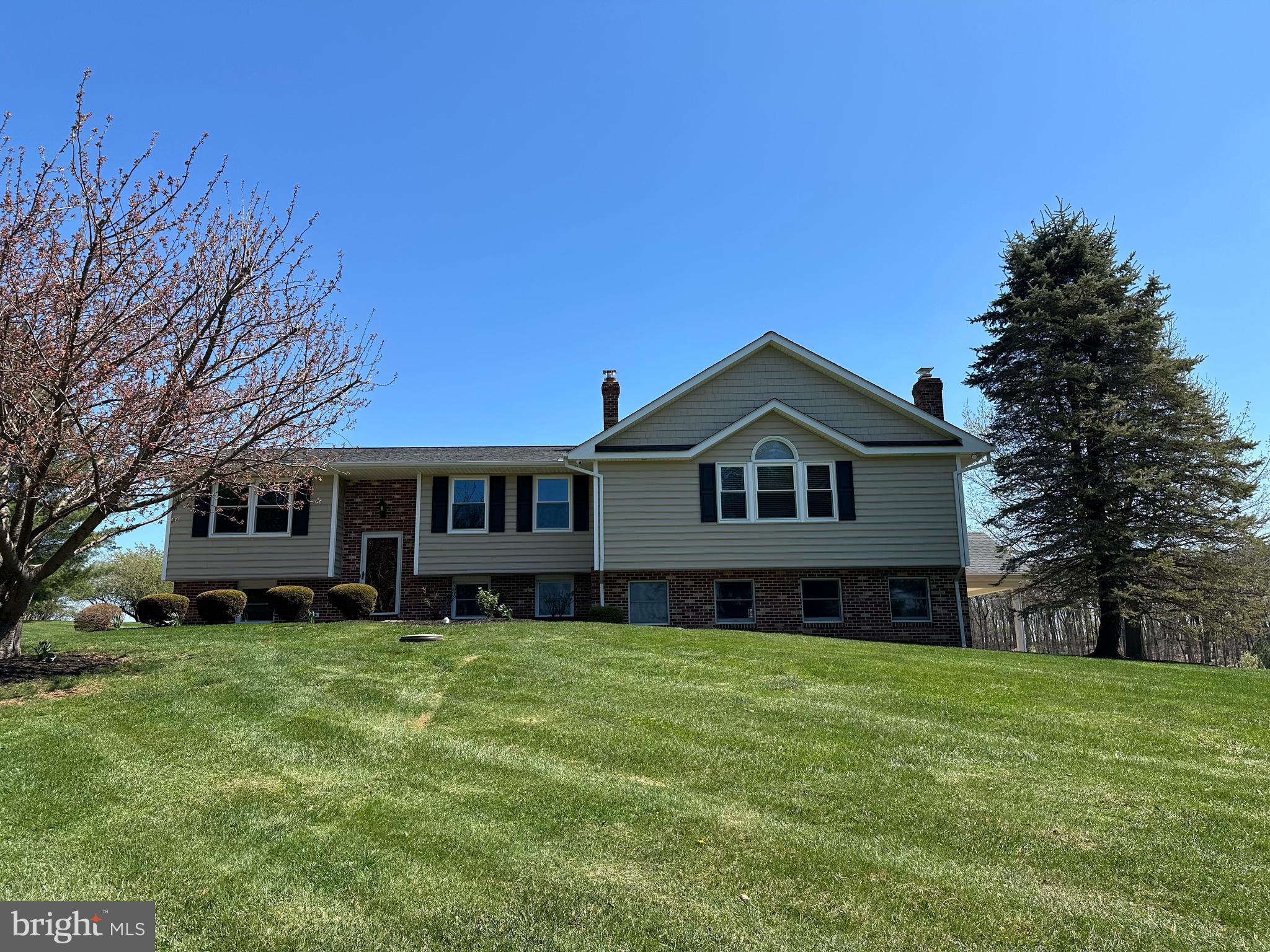 3457 Baker Road Westminster, MD 21157 - Photo 1 of 105 a front view of a house with a yard and trees
