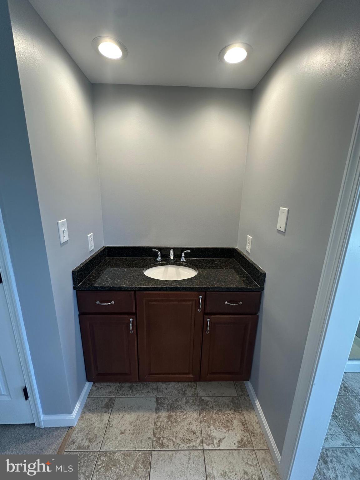 3457 Baker Road Westminster, MD 21157 - Photo 33 of 105 a bathroom with a sink and a mirror