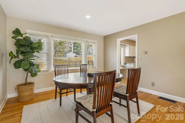 a view of a livingroom with furniture and a potted plant
