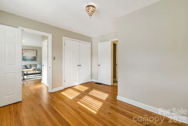 a view of a livingroom with wooden floor