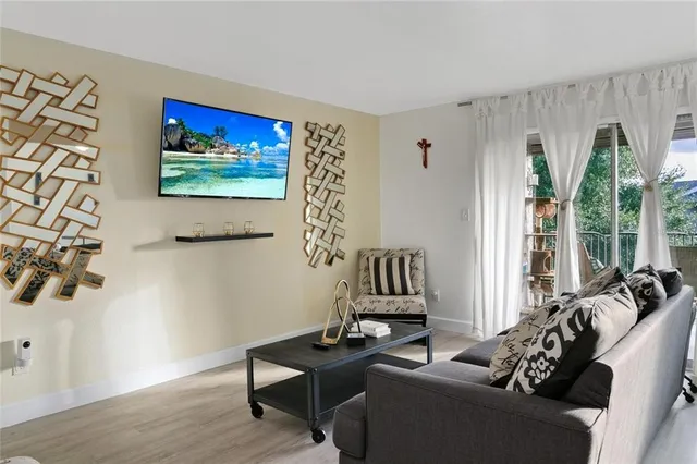 a kitchen with stainless steel appliances kitchen island granite countertop a table and chairs in it