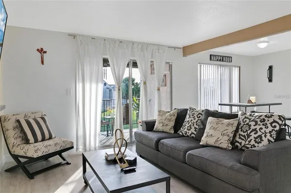 a living room with furniture and a large window