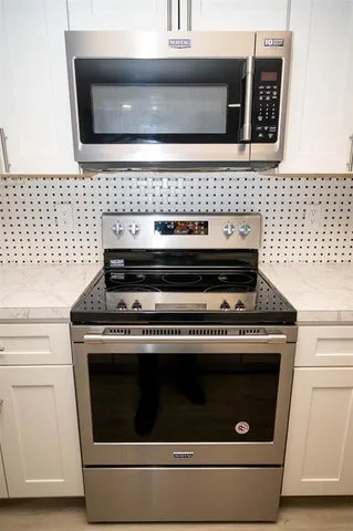 a bathroom with a double vanity sink and mirror