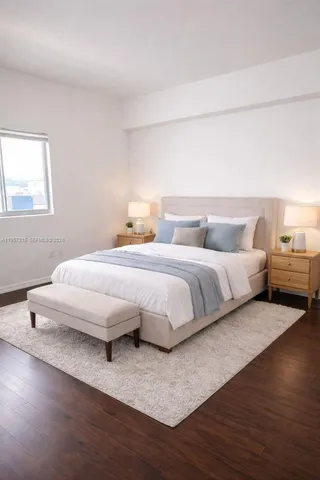 a bedroom with a bed and a night stand