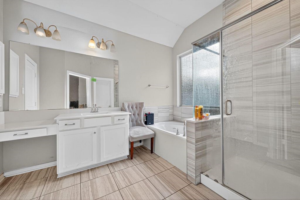 12154 Texas Trumpet Trail Humble, TX 77346 - Photo 12 of 21 a bathroom with a sink a toilet and mirror