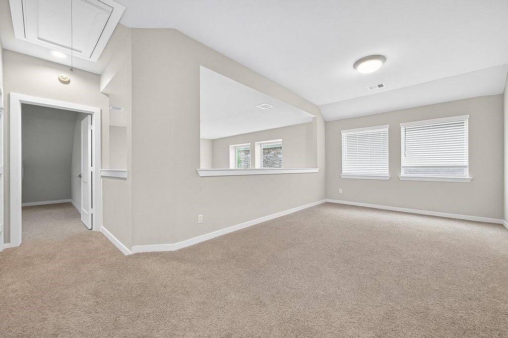 12154 Texas Trumpet Trail Humble, TX 77346 - Photo 19 of 21 a view of an empty room with a window