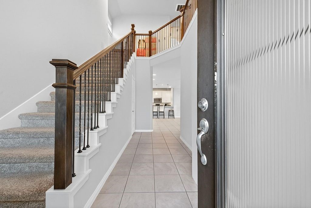 12154 Texas Trumpet Trail Humble, TX 77346 - Photo 4 of 21 a view of a hallway with wooden floor and entryway