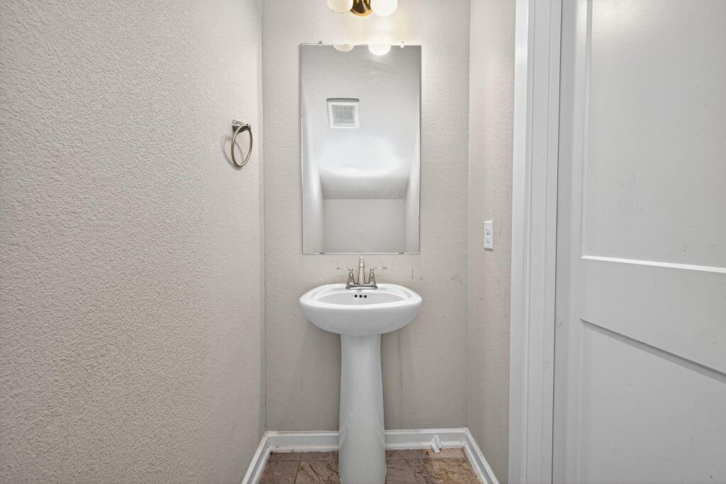 12154 Texas Trumpet Trail Humble, TX 77346 - Photo 9 of 21 a bathroom with a sink and a mirror