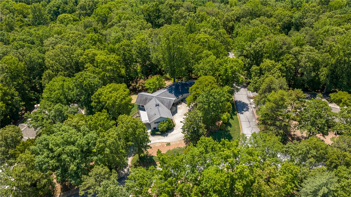 118 Beacon Ridge Circle Salem, SC 29676 - Photo 43 of 45 Nestled amidst verdant trees, this property offers a private, serene escape with ample natural surroundings.