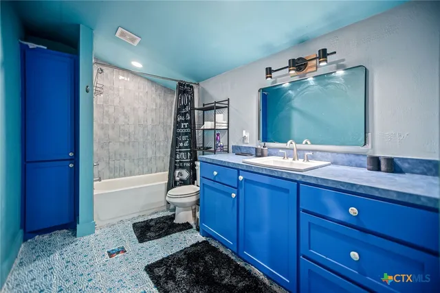 a view of a ocean from a floor to ceiling window and an outdoor view