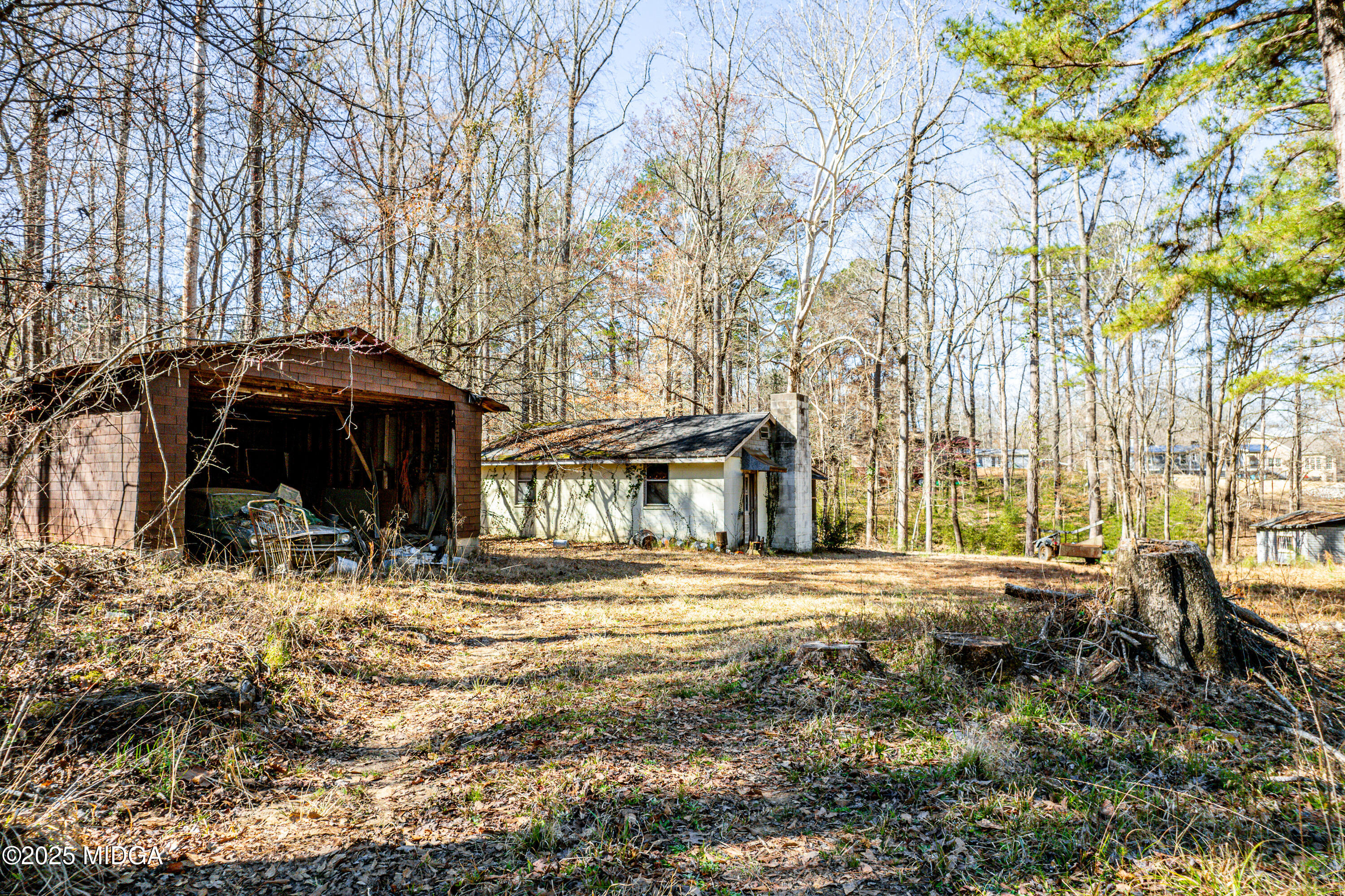 101 West Bear Creek Road Eatonton, GA 31024 - Photo 11 of 12 a front view of a house with a yard