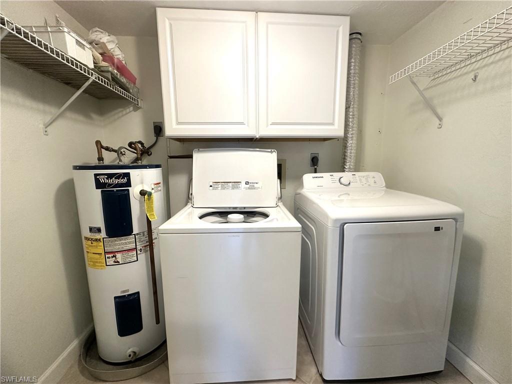 2375 Naples Trace Circle, Unit 7 Naples, FL 34109 - Photo 24 of 28 a utility room with dryer and washer
