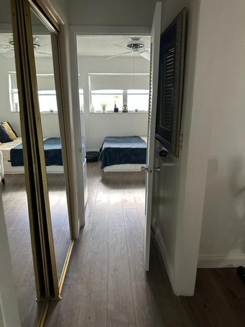 Undisclosed Address Lauderhill, FL 33313 - Photo 18 of 25 a view of a hallway with wooden floor and a bathroom