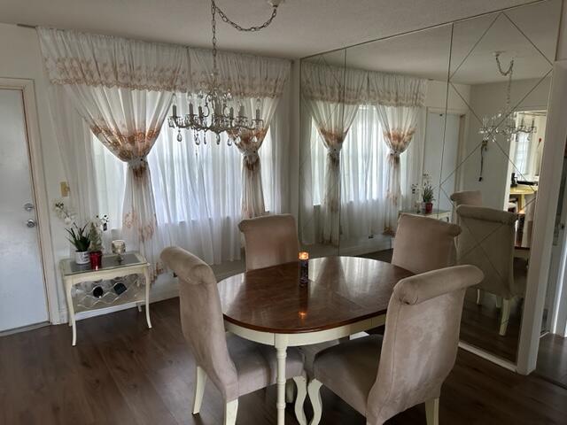 Undisclosed Address Lauderhill, FL 33313 - Photo 7 of 25 a kitchen with a table chairs and entryway