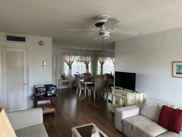 Undisclosed Address Lauderhill, FL 33313 - Photo 9 of 25 a living room with furniture and a flat screen tv
