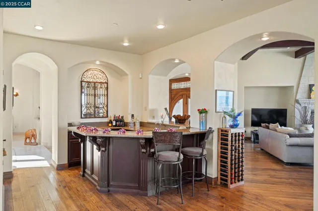 a dining room with furniture and wooden floor