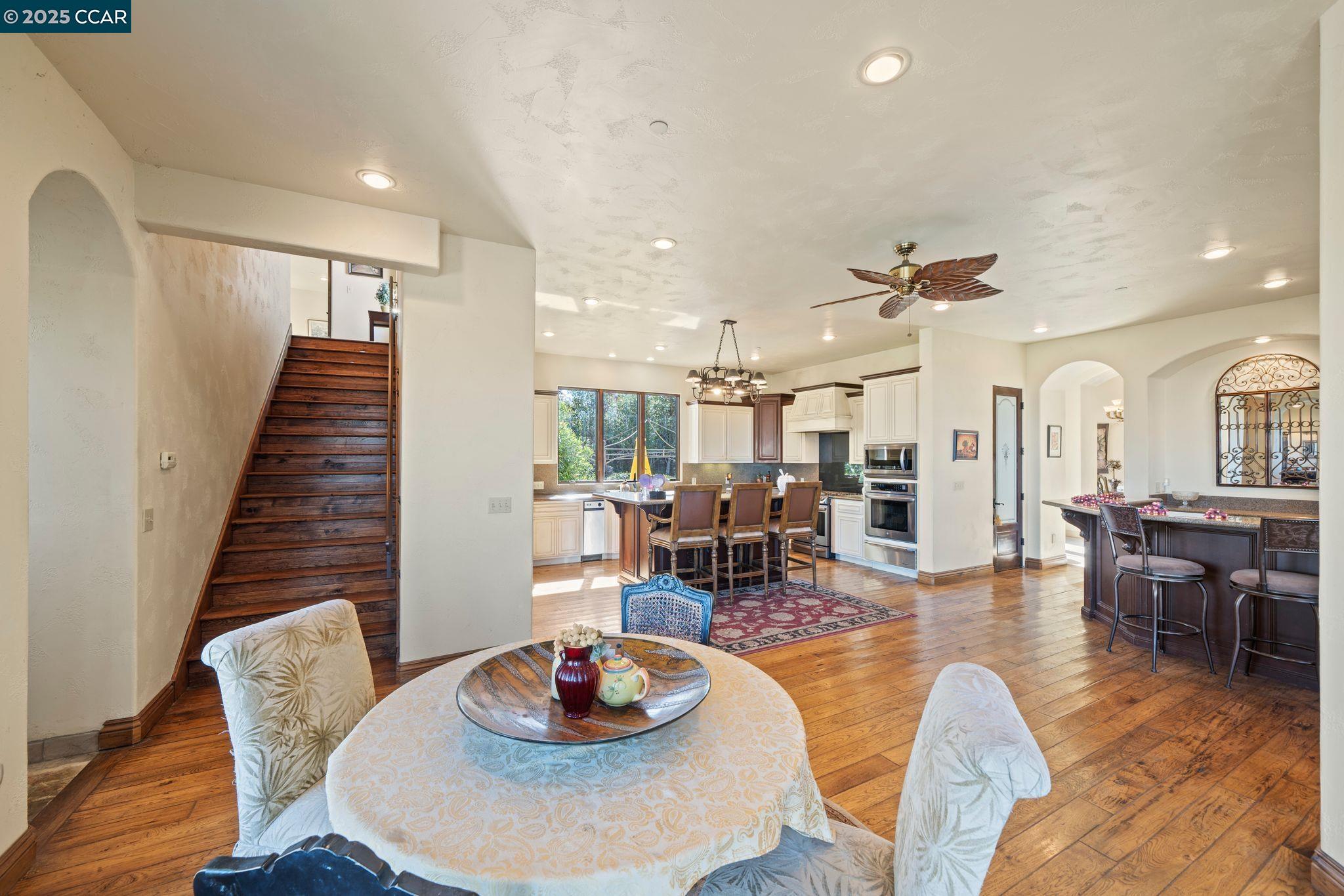 633 Kalthoff Common Livermore, CA 94550 - Photo 12 of 60 a dining room with furniture and wooden floor