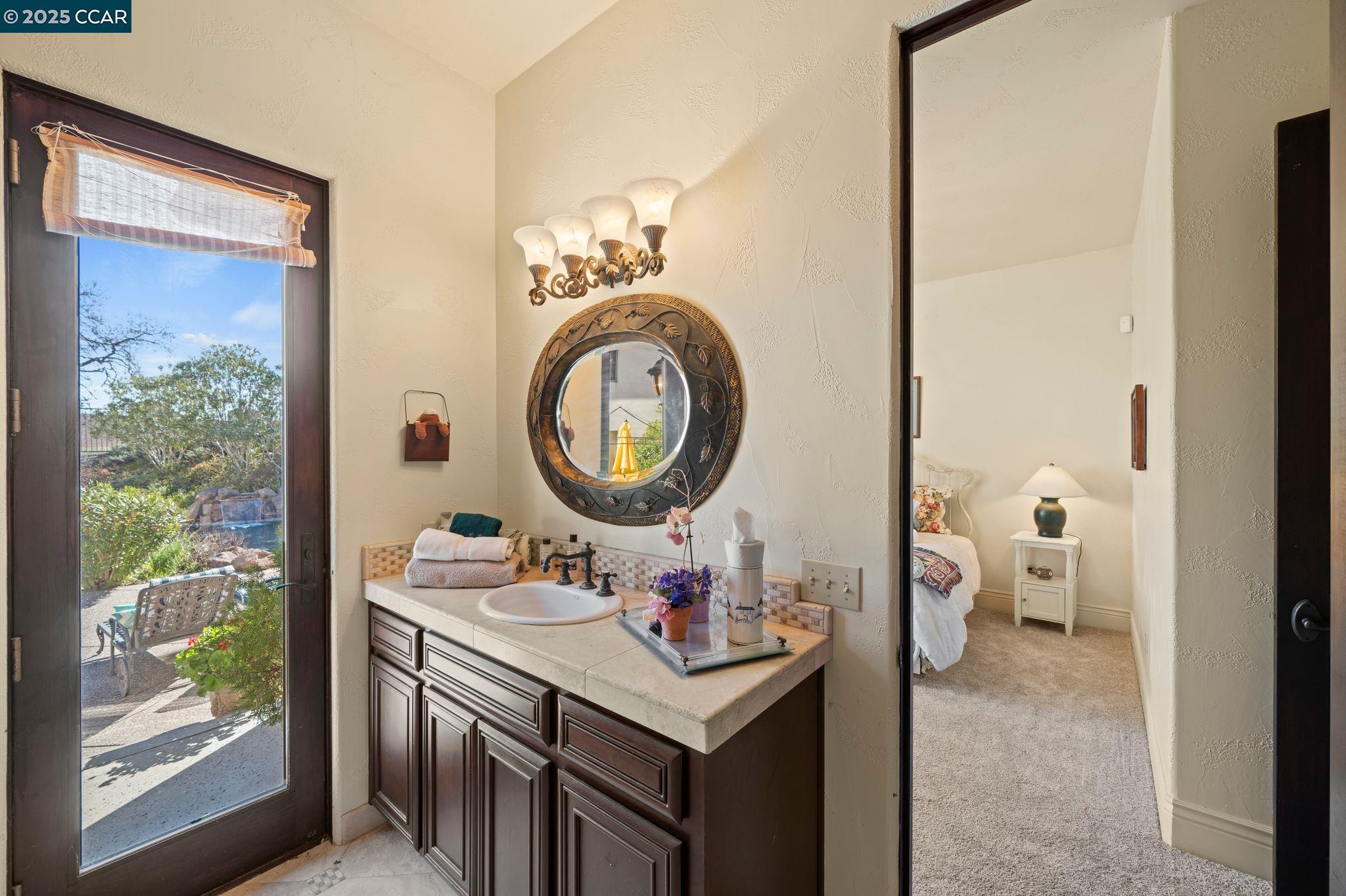 633 Kalthoff Common Livermore, CA 94550 - Photo 14 of 60 a bathroom with a sink vanity and a mirror