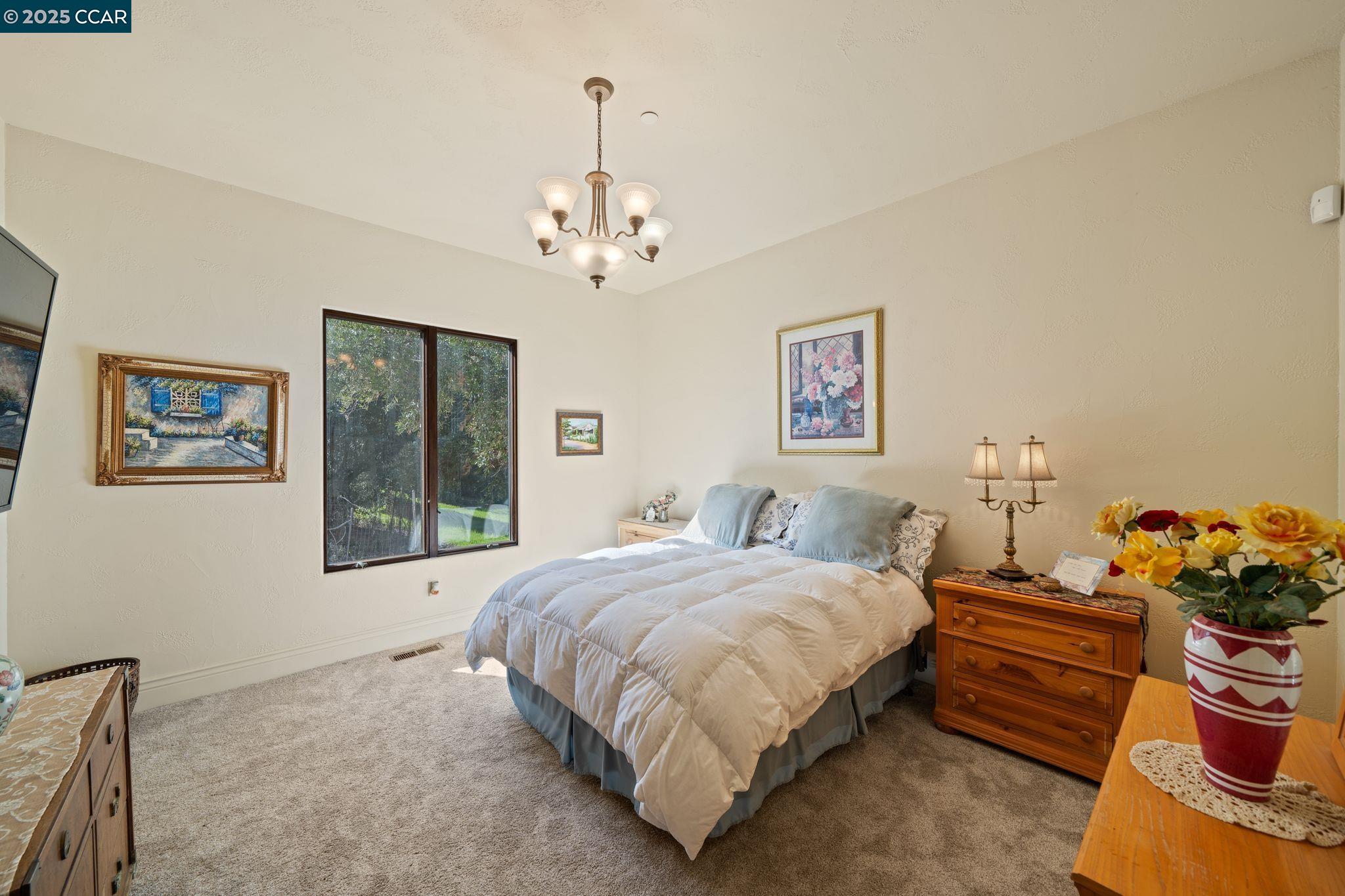 633 Kalthoff Common Livermore, CA 94550 - Photo 21 of 60 a bedroom with a bed mirror and window