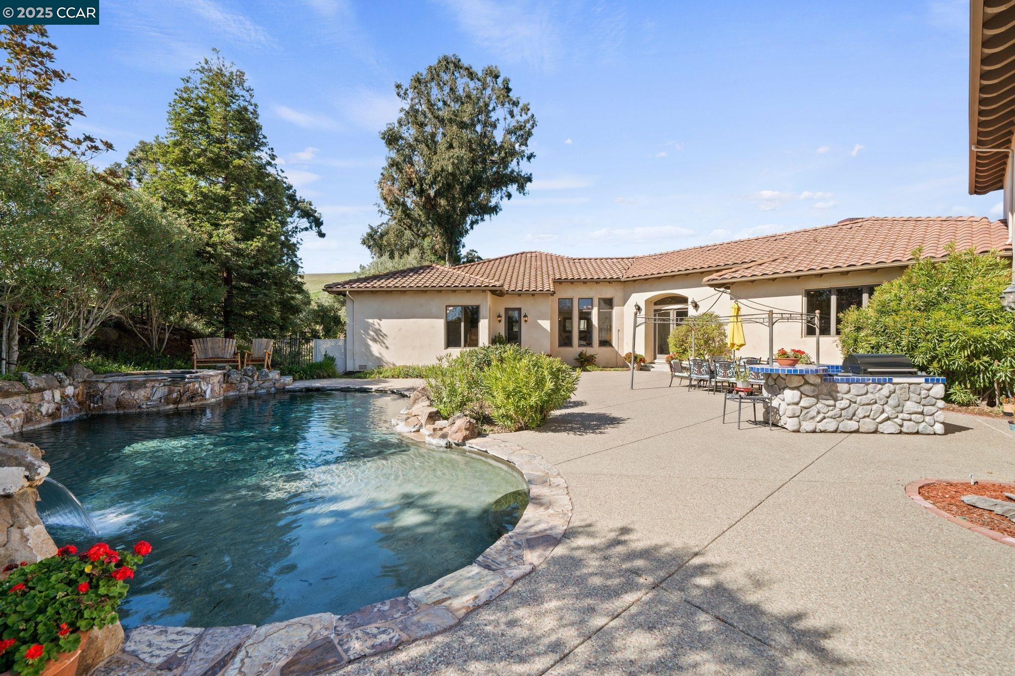 633 Kalthoff Common Livermore, CA 94550 - Photo 28 of 60 a view of a house with swimming pool and sitting area