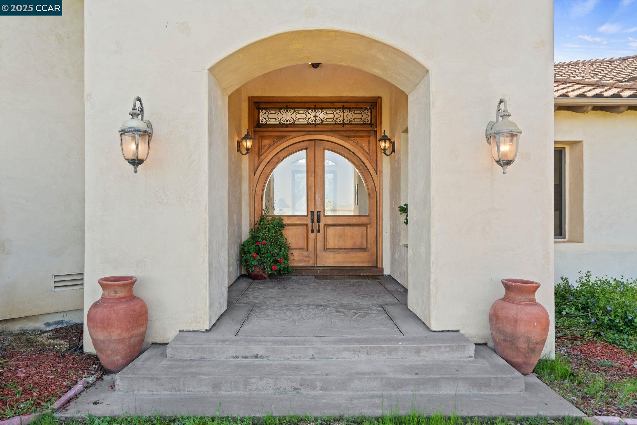 633 Kalthoff Common Livermore, CA 94550 - Photo 4 of 60 a view of a hallway with entryway wooden floor and a chandelier