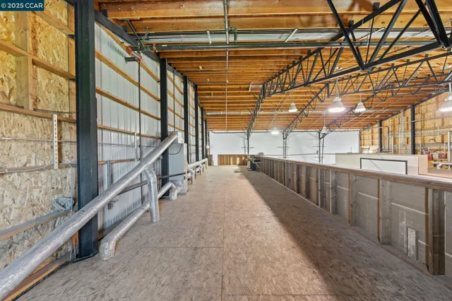 a view of a street with a garden