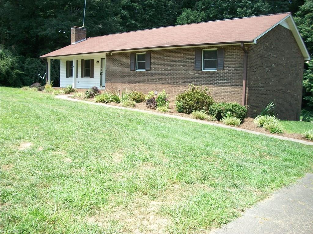 391 Farmstead Road Winston-Salem, NC 27107 - Photo 3 of 26 FRONT WITH A COVERED FRONT PORCH/PAVED WALK WAY