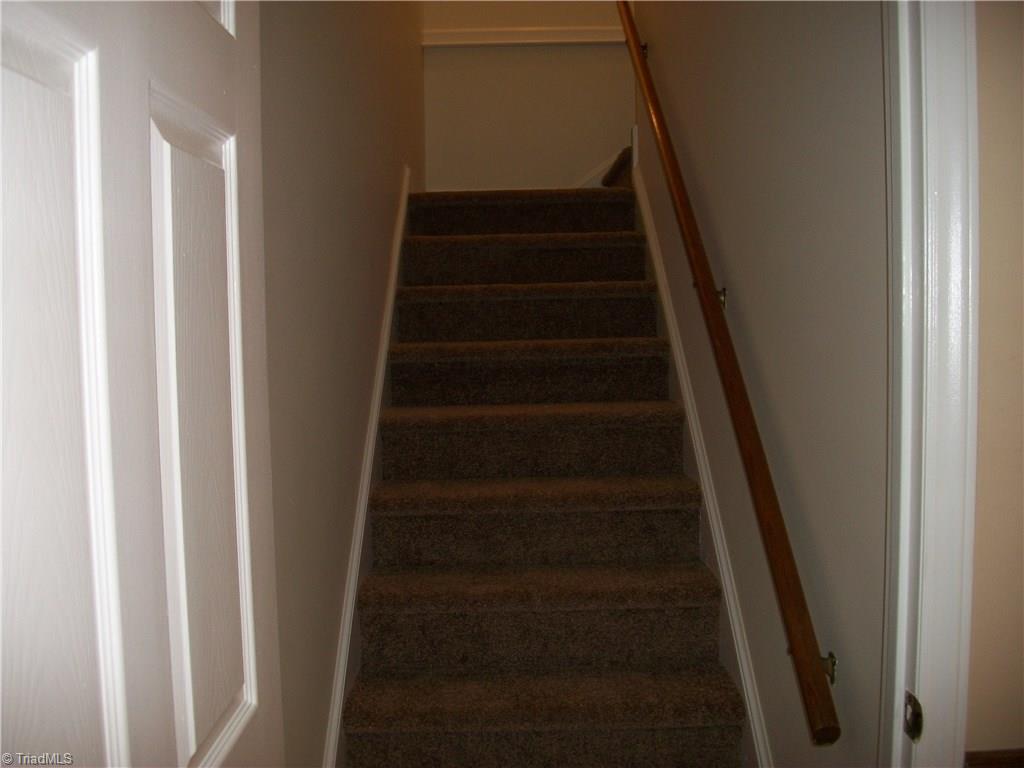 391 Farmstead Road Winston-Salem, NC 27107 - Photo 8 of 26 BRAND NEW CARPET ON THE STAIRS LEADING TO THE MAIN LEVEL