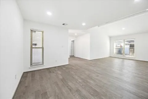 a living room with fireplace furniture and a flat screen tv