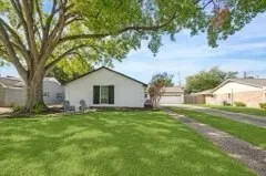 a house view with a garden space