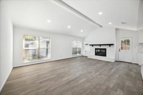a view of kitchen with granite countertop cabinets and oven