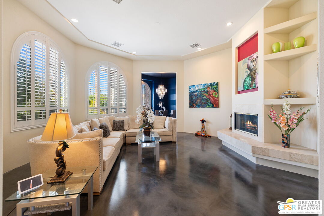 36630 Palm Court Rancho Mirage, CA 92270 - Photo 11 of 46 a living room with furniture and a fireplace