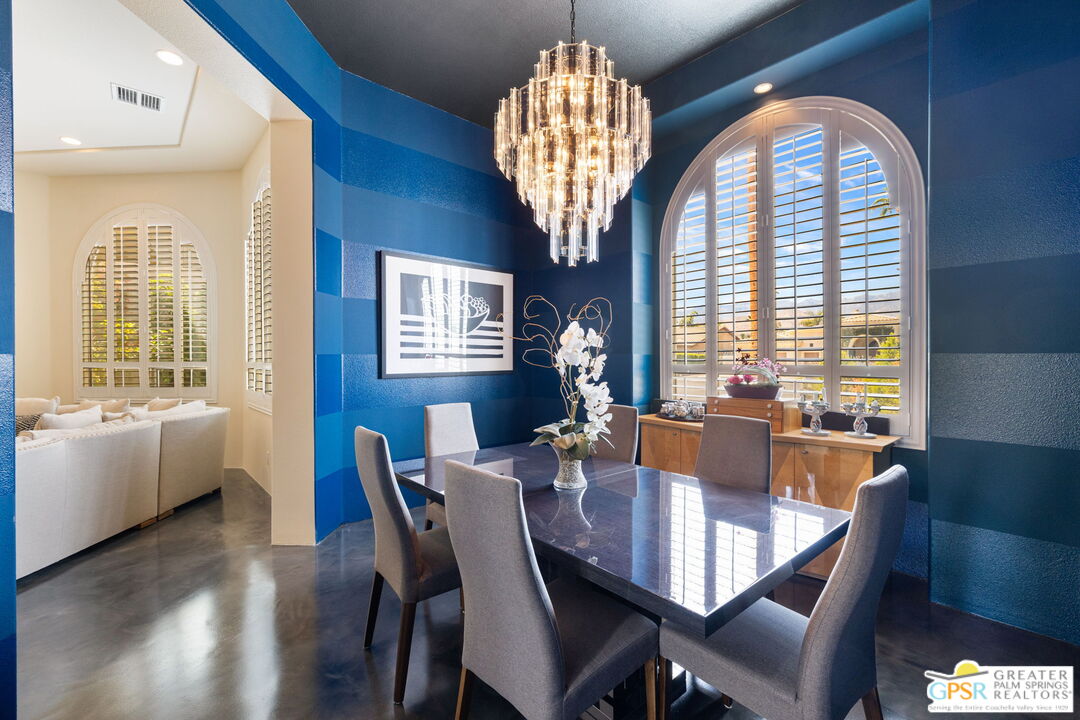 36630 Palm Court Rancho Mirage, CA 92270 - Photo 14 of 46 a view of a dining room with furniture window and wooden floor