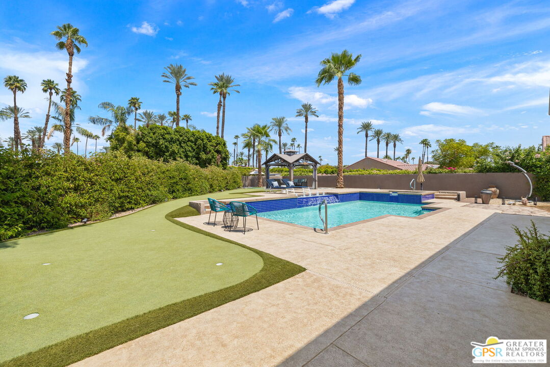 36630 Palm Court Rancho Mirage, CA 92270 - Photo 22 of 46 a view of a swimming pool with an outdoor seating
