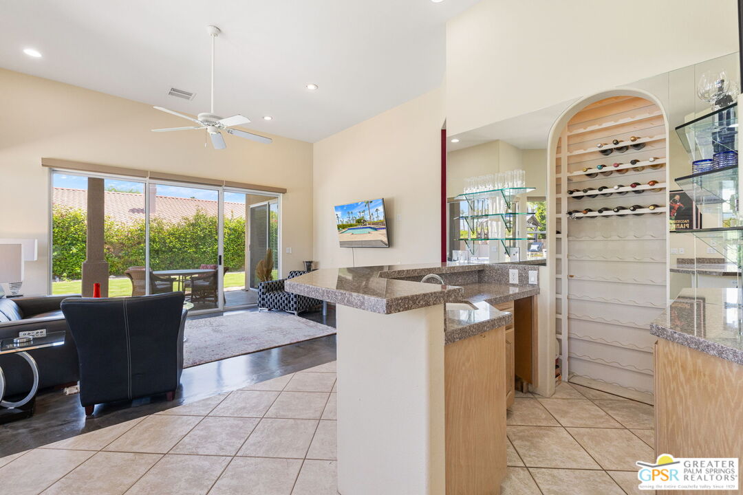 36630 Palm Court Rancho Mirage, CA 92270 - Photo 26 of 46 a kitchen with stainless steel appliances granite countertop a stove and a refrigerator